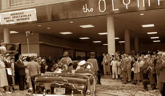 a group of people standing in front of a building