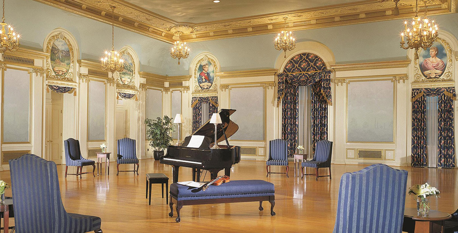 a piano in a room with chairs