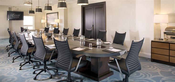 a long conference table with chairs