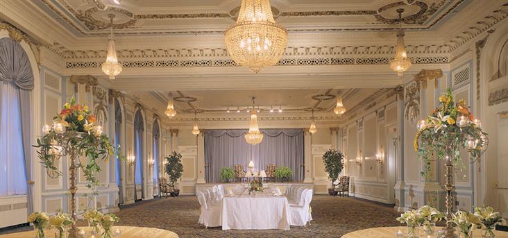 a large room with a table and chairs