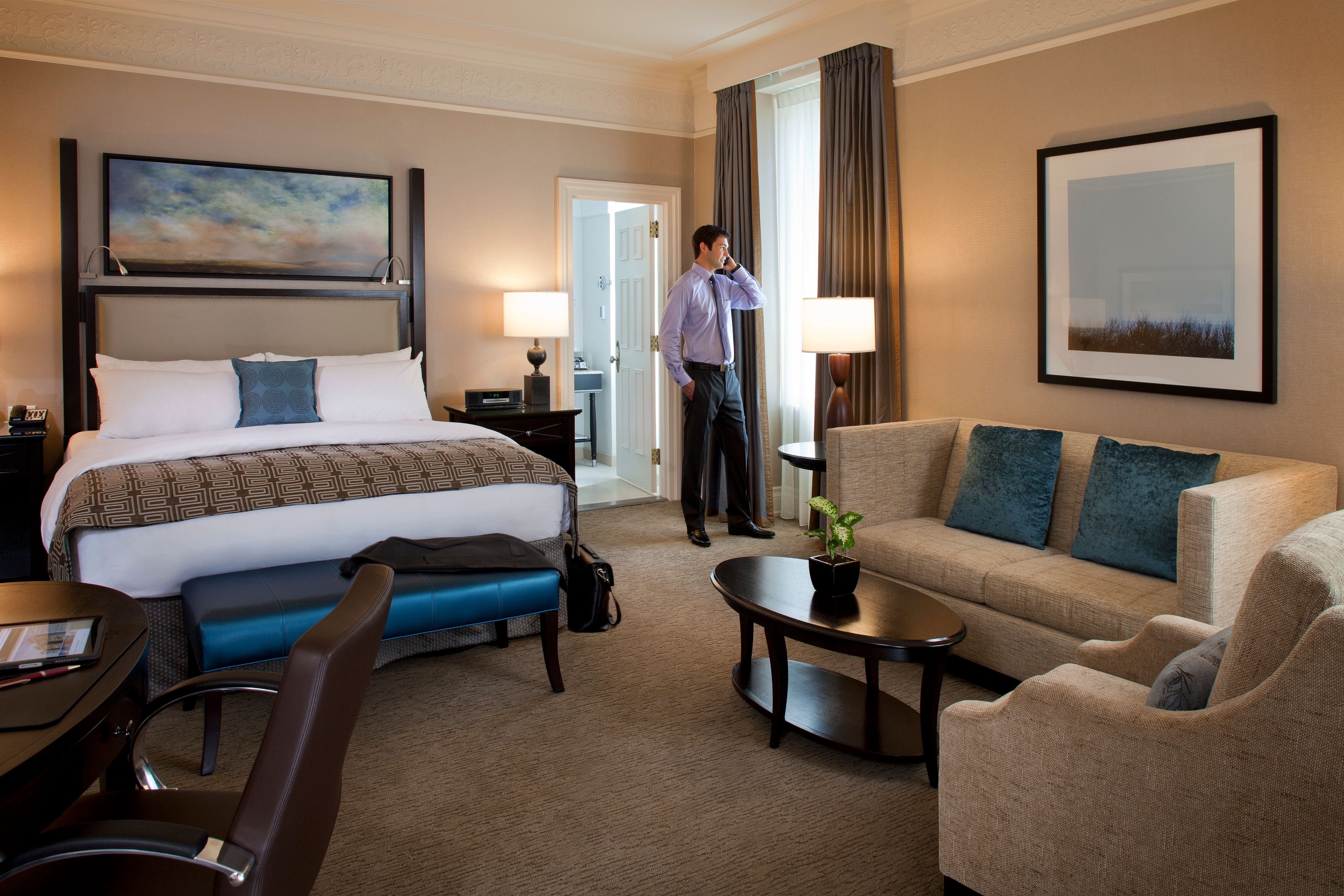 a man standing in a hotel room