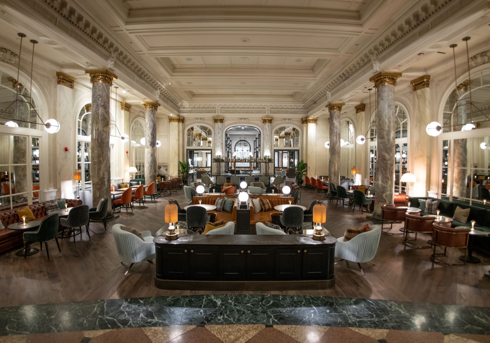 a large room with a large ceiling and columns