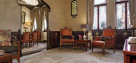 a room with a mirror and chairs