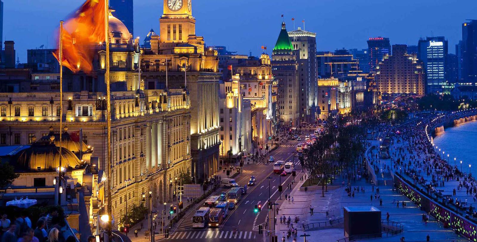 a city street with many buildings and cars