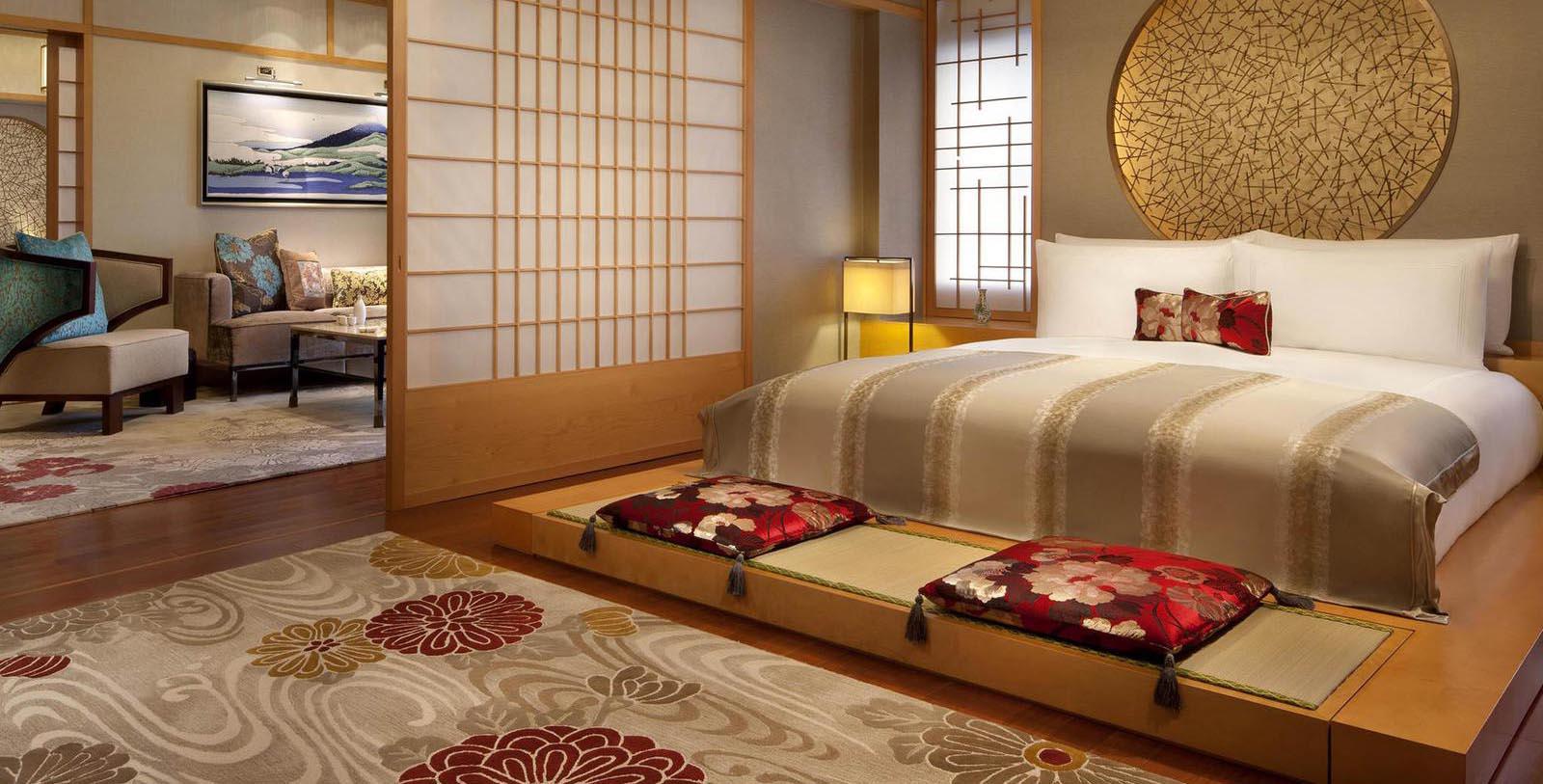 a bedroom with a bed and a rug