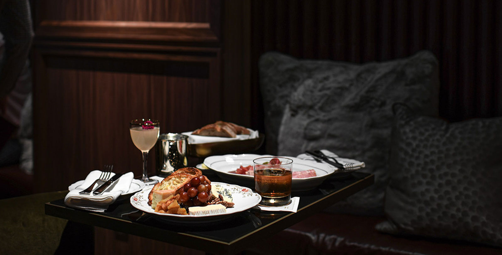 a table with plates of food and drinks