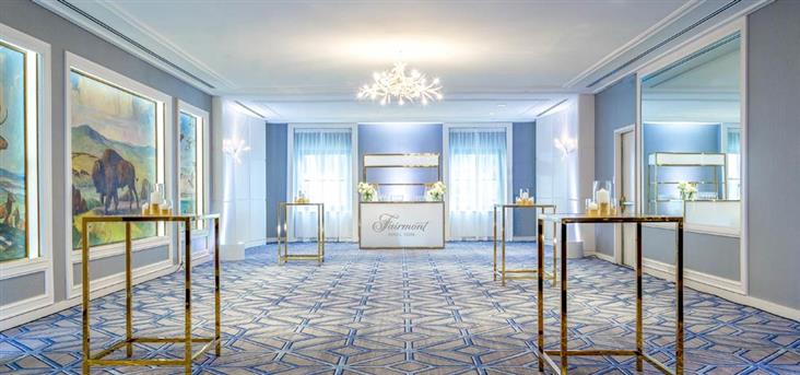 a room with tables and a chandelier