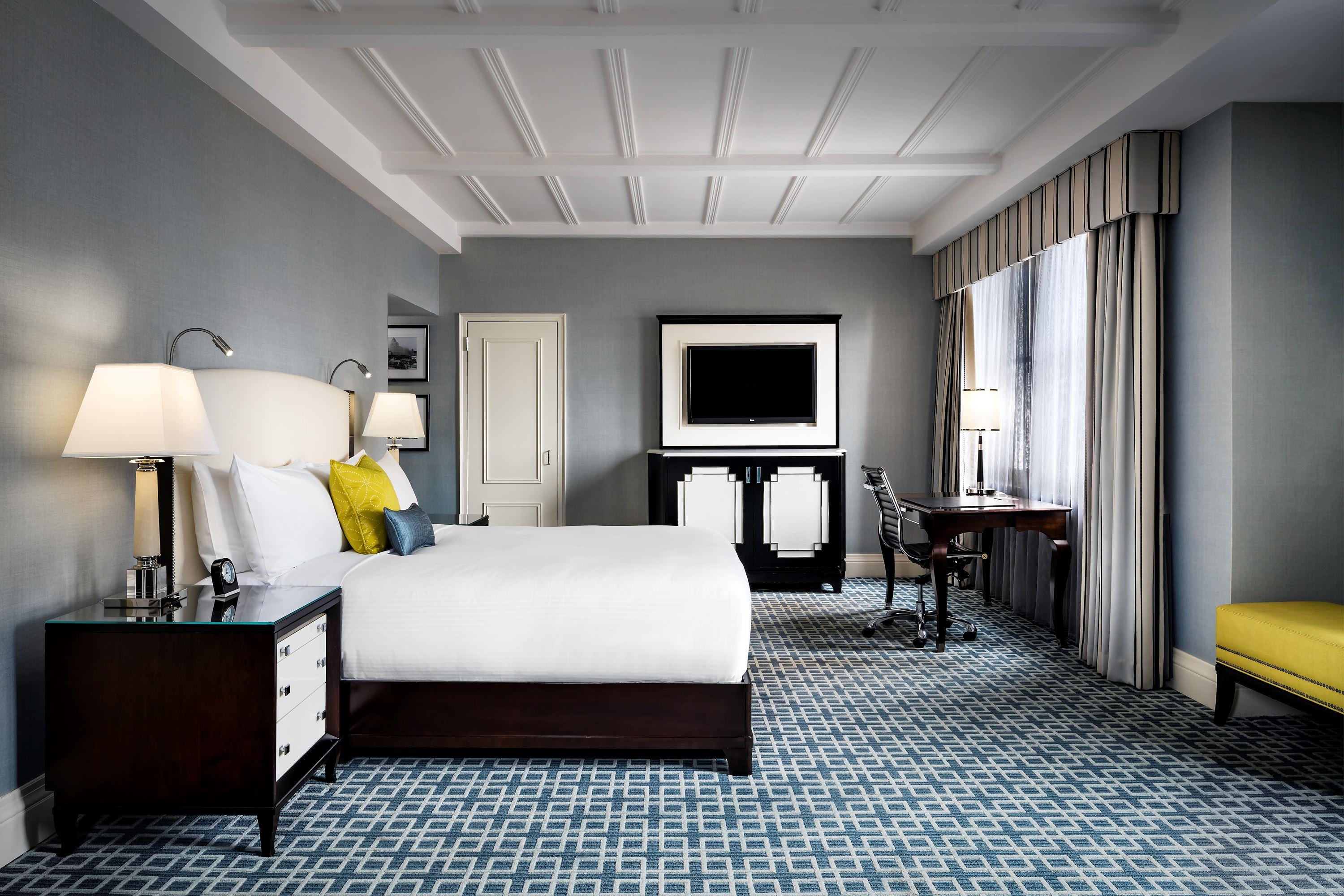 a room with a bed and a desk