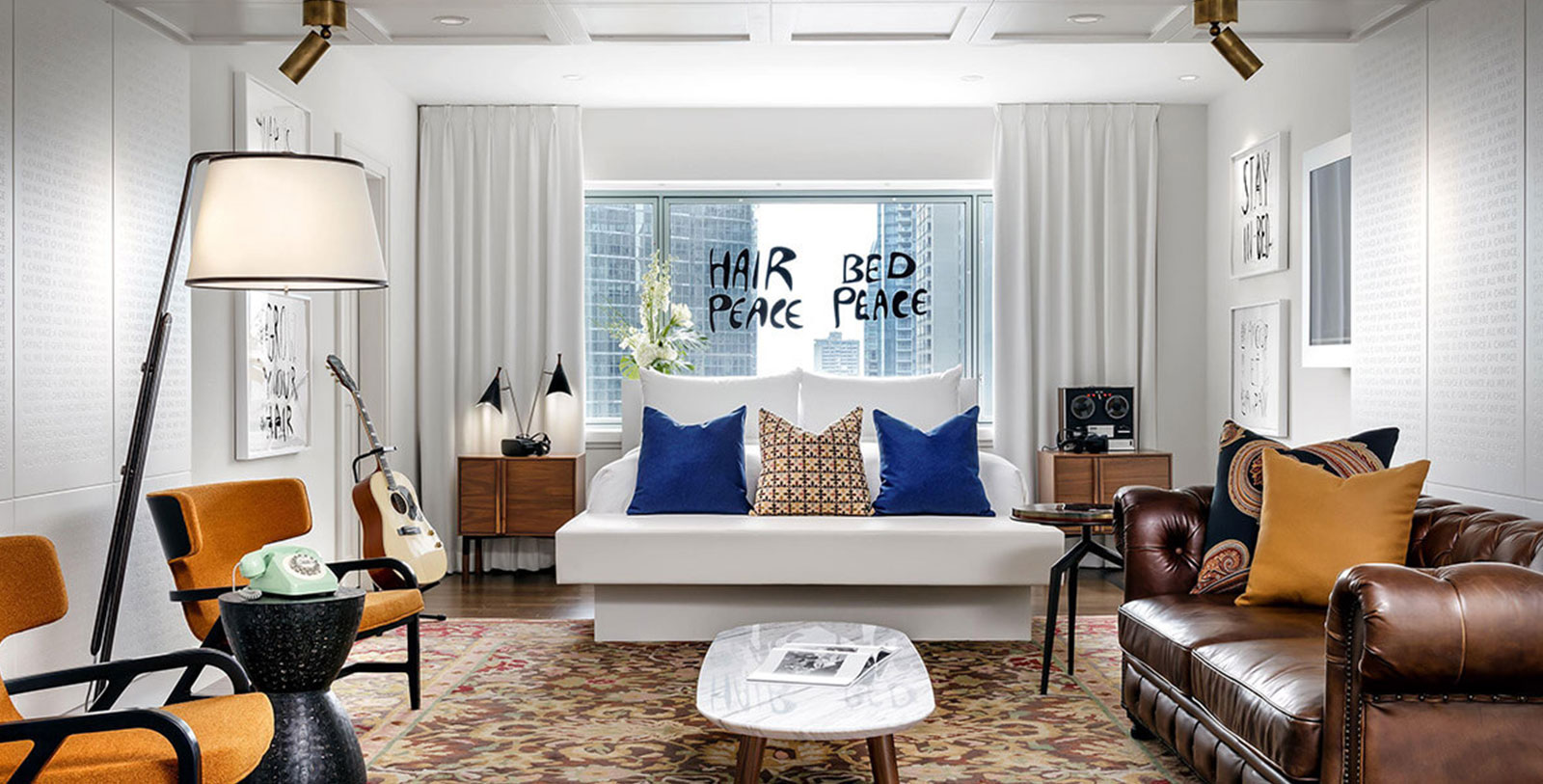 a room with a guitar and a couch