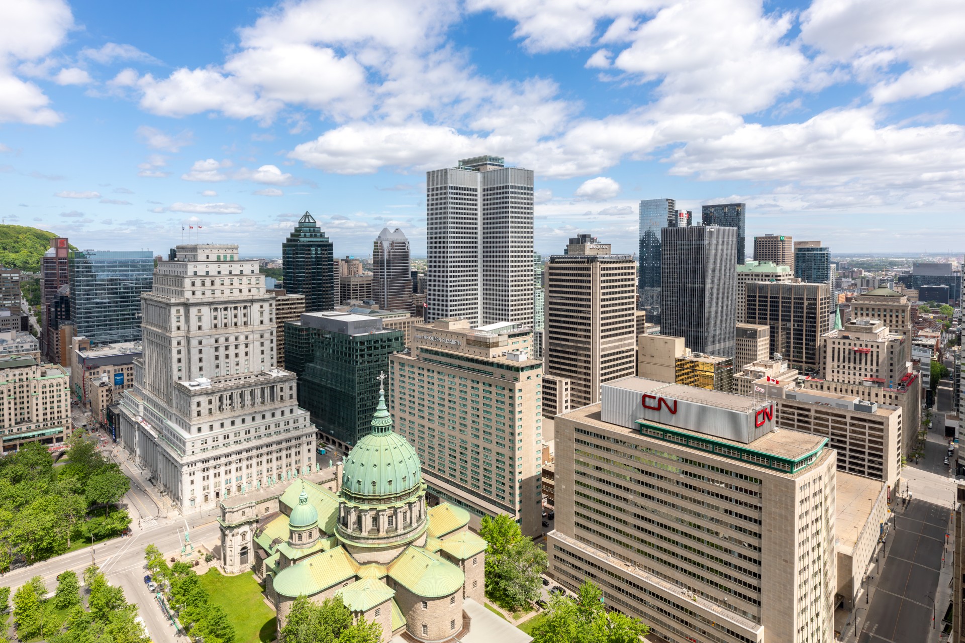 a city with tall buildings and a green dome