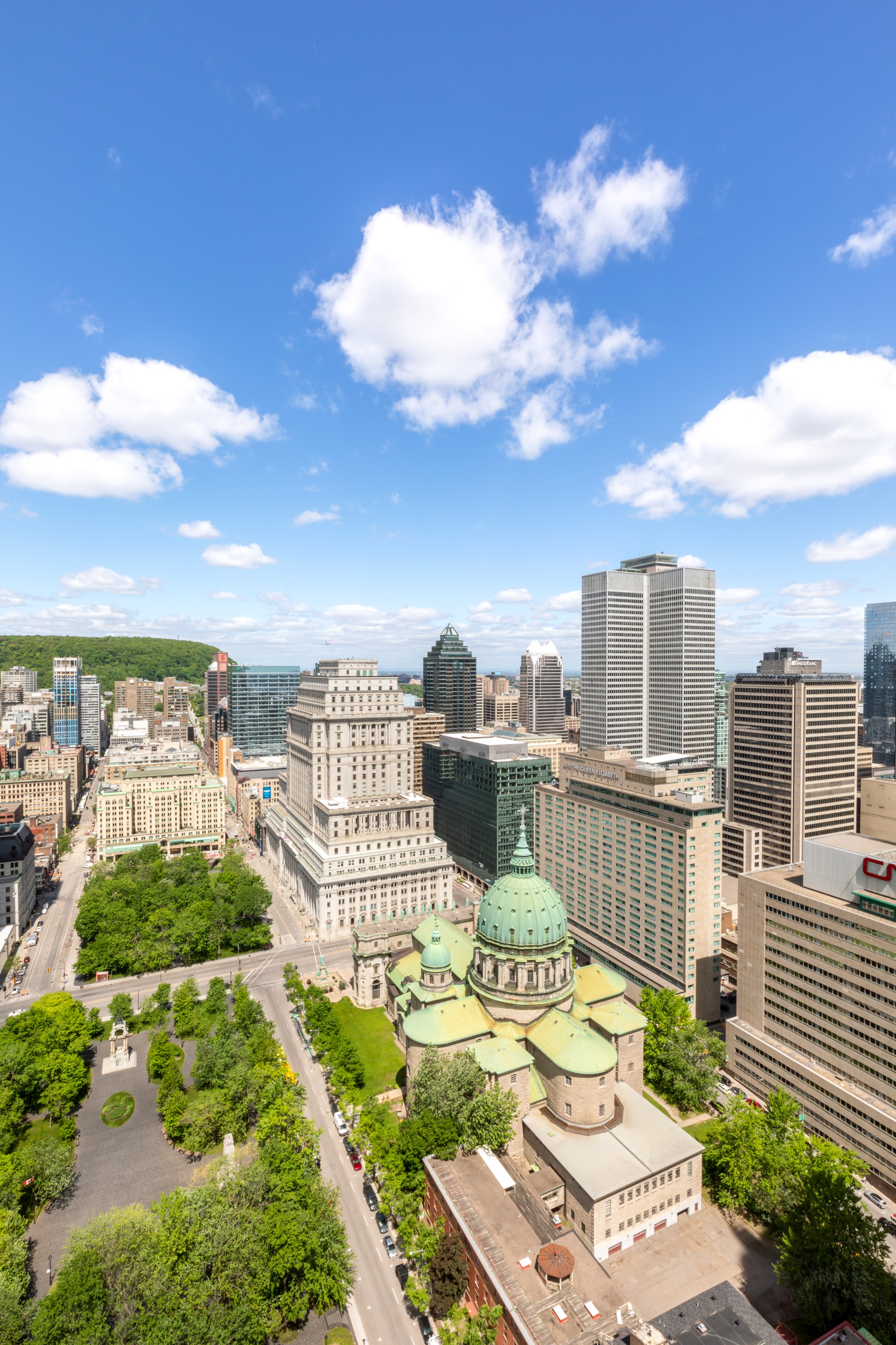 a city with tall buildings and trees