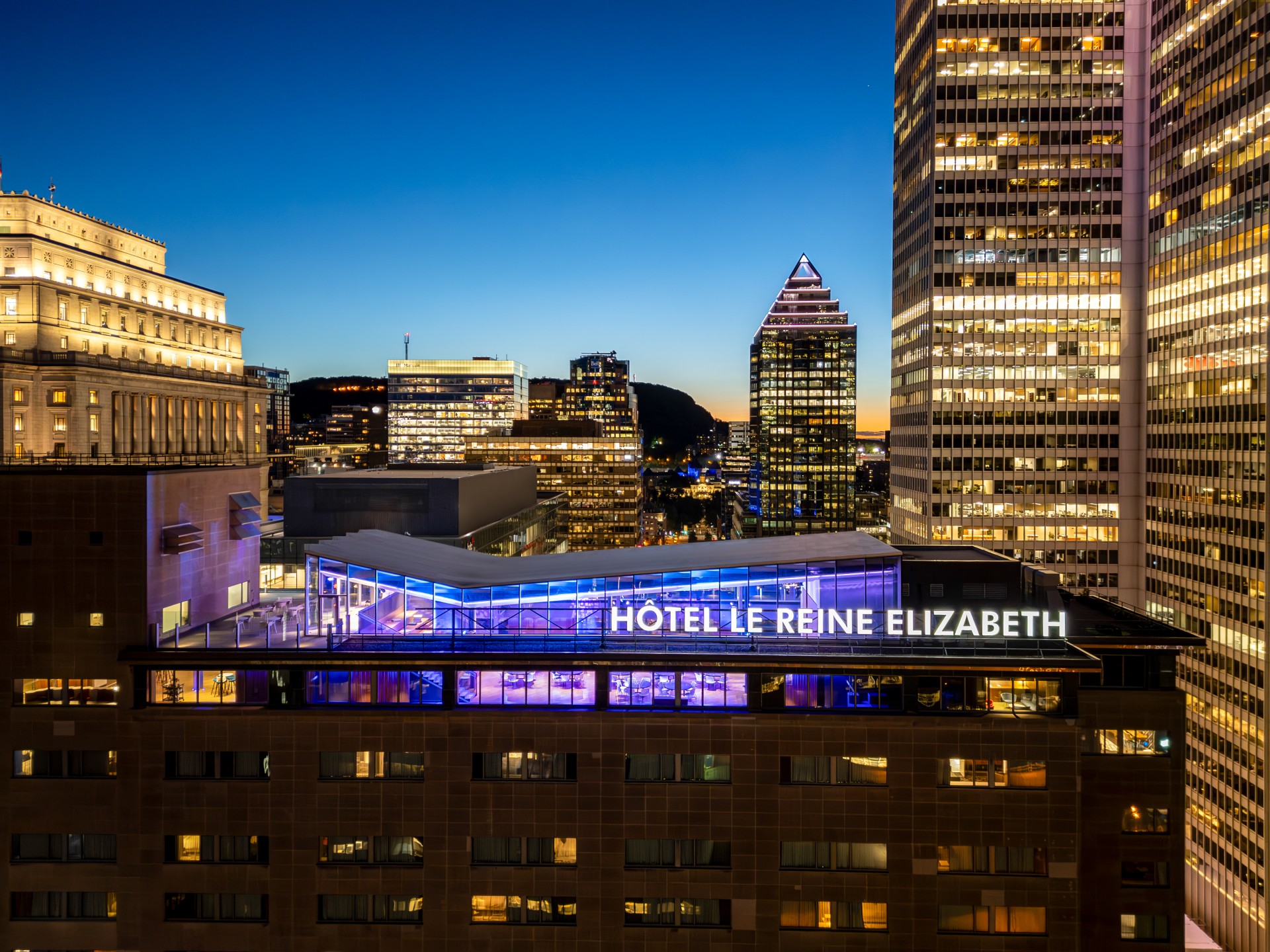 a city skyline with a hotel and skyscrapers