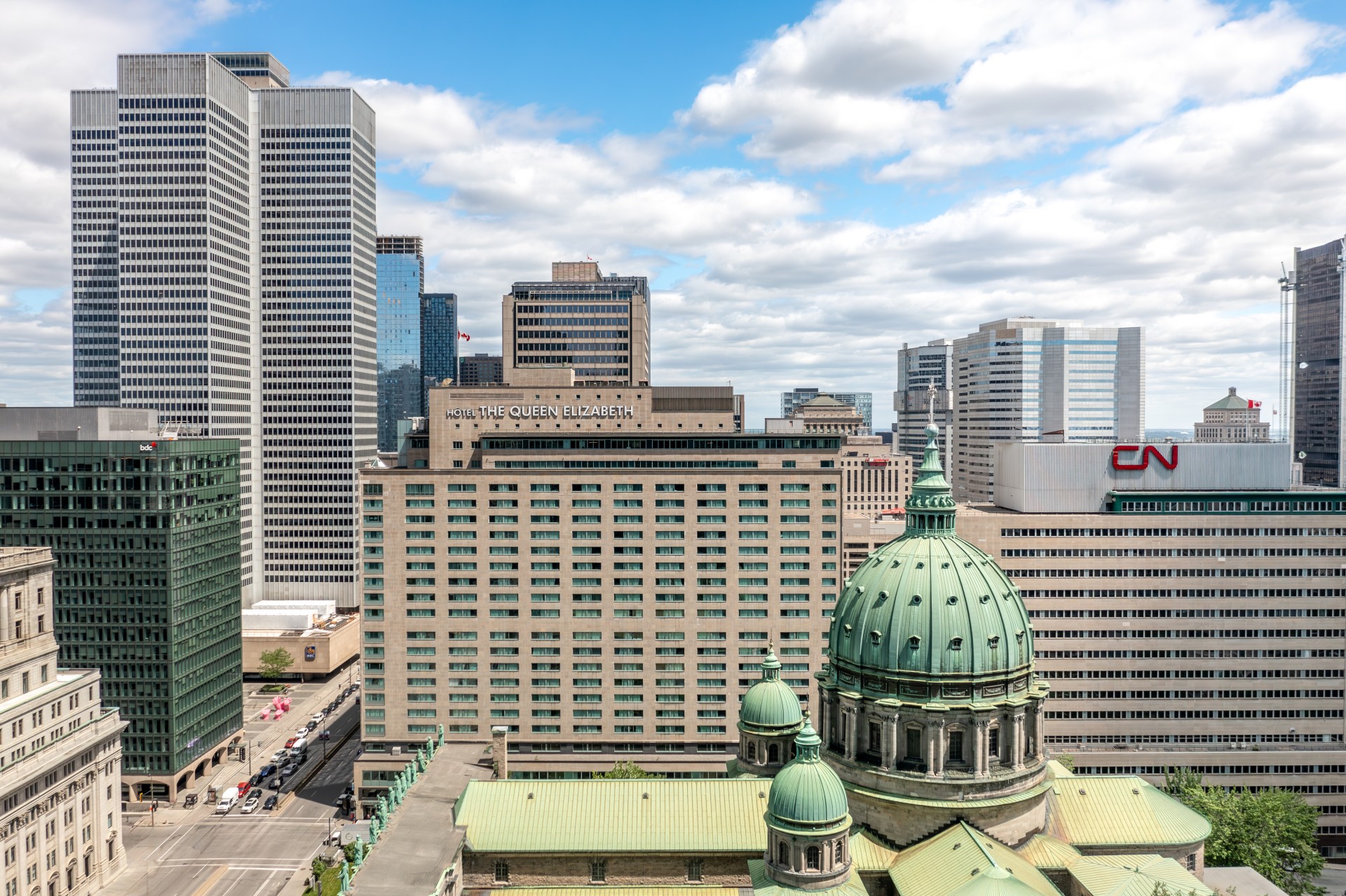 a city with tall buildings and a dome