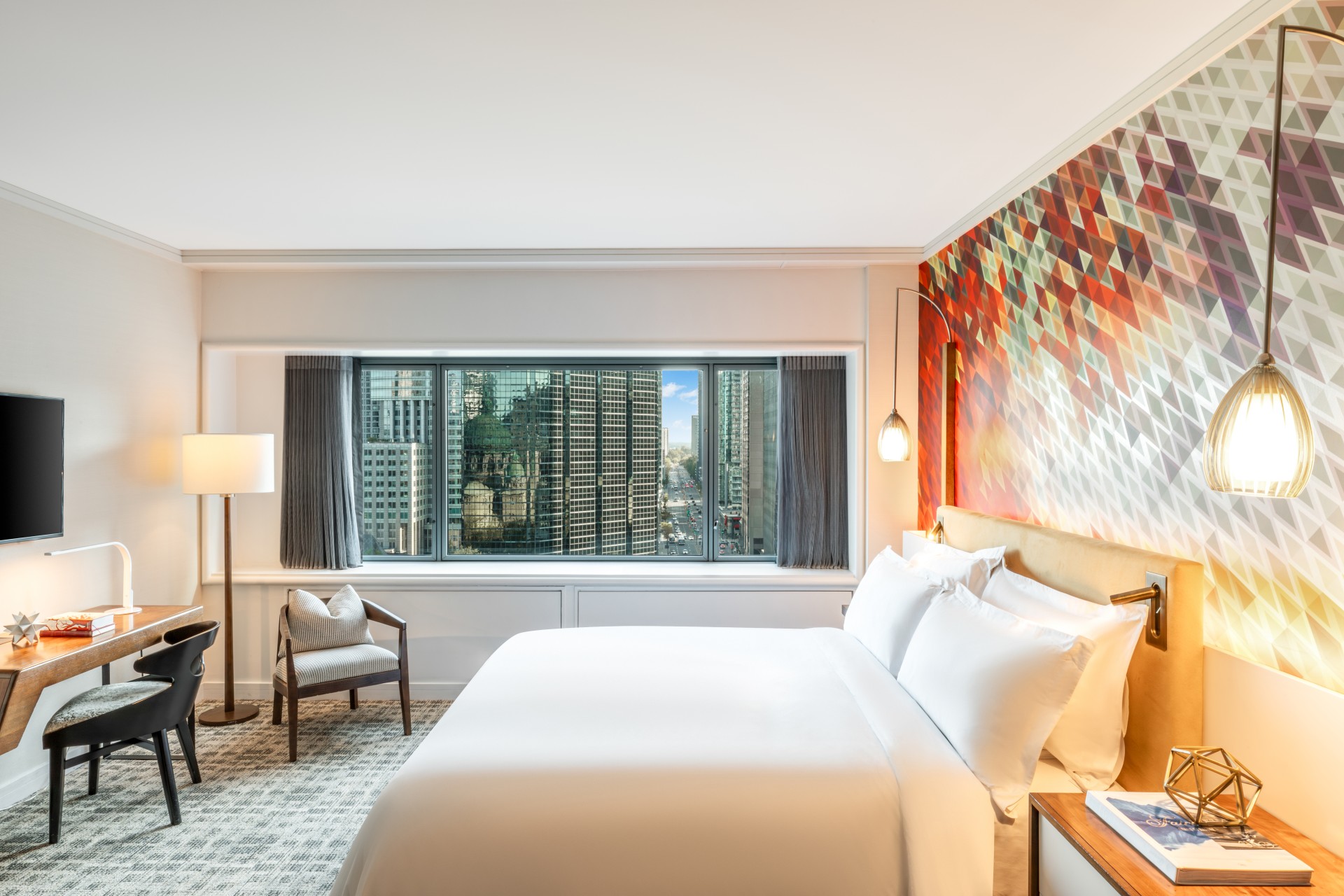 a bedroom with a bed and a chair