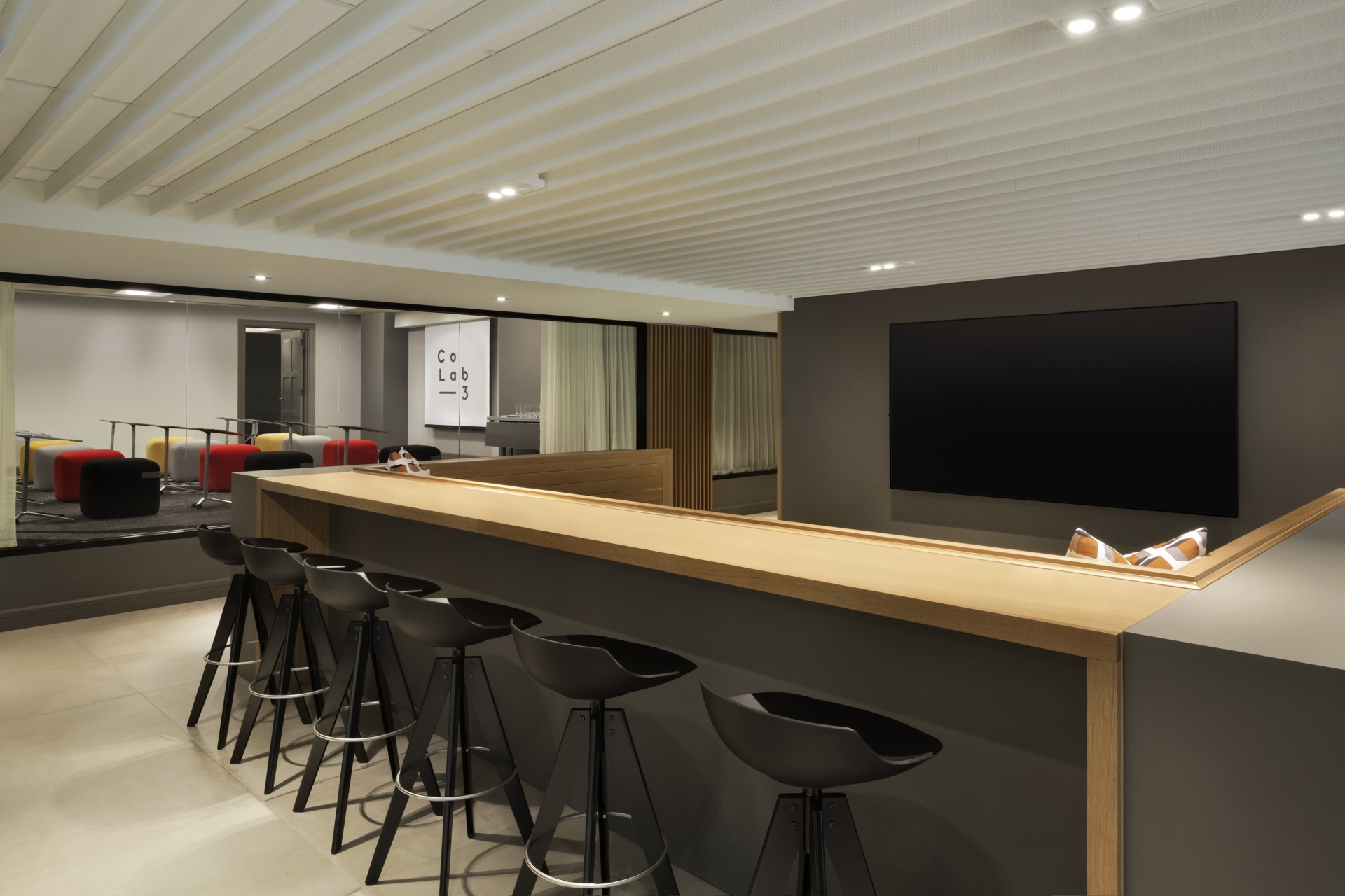 a bar with stools in a room