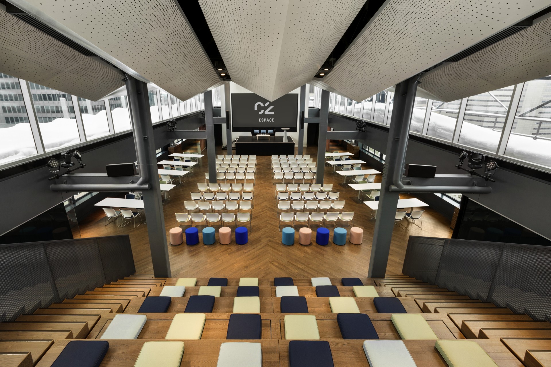 a room with rows of chairs and tables