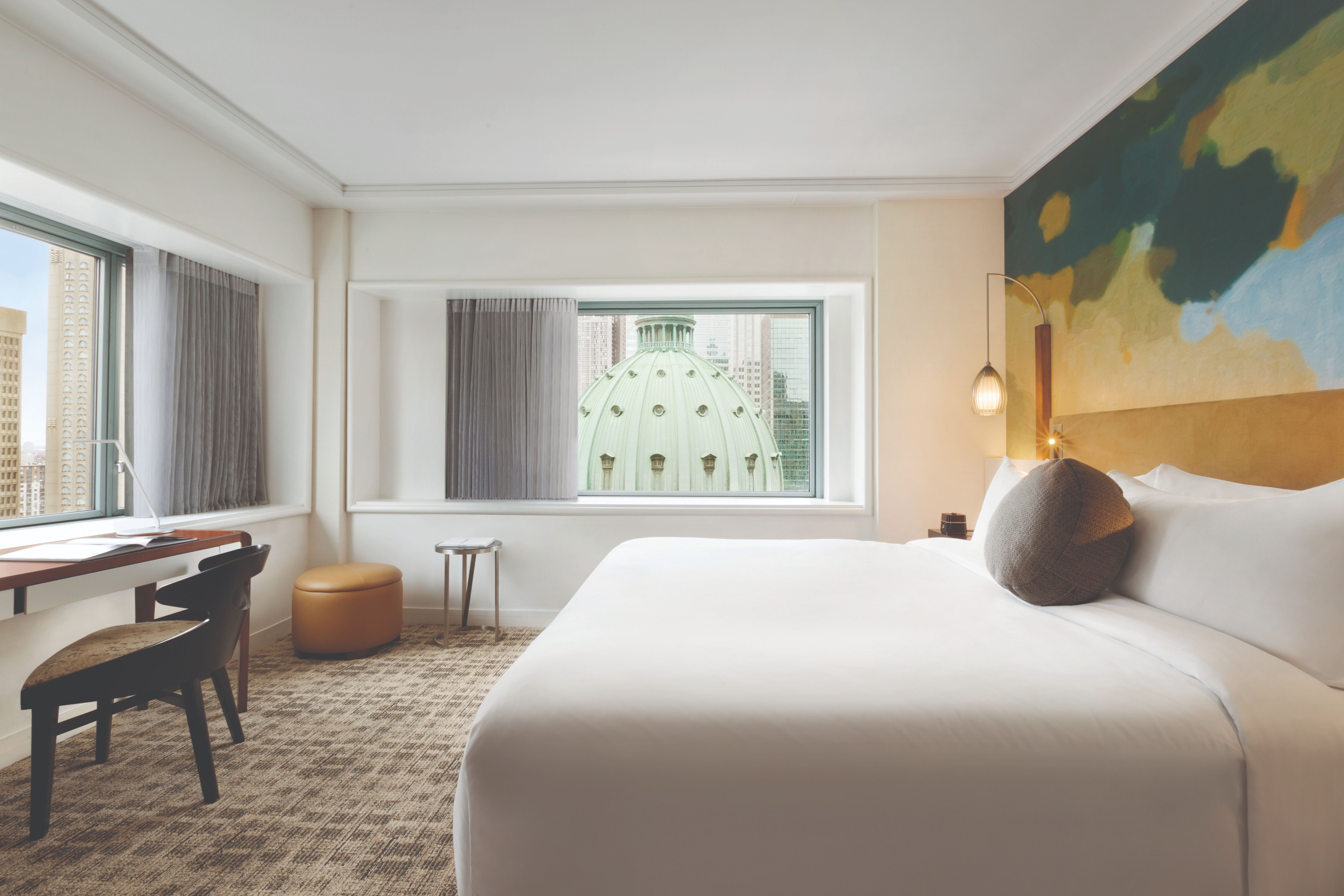 a room with a bed and a piano