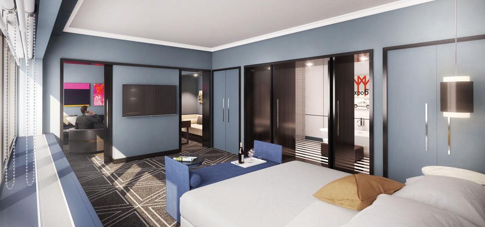 a bedroom with a bed and a tv