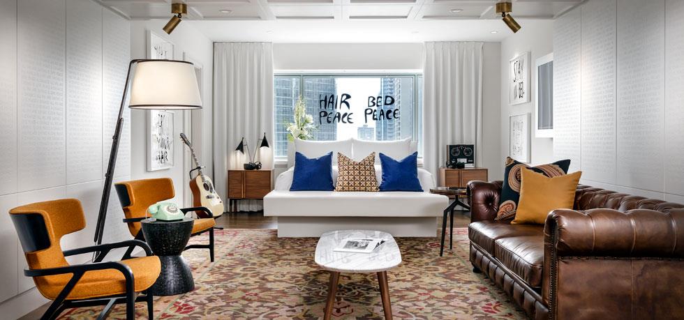 a room with a couch and a guitar