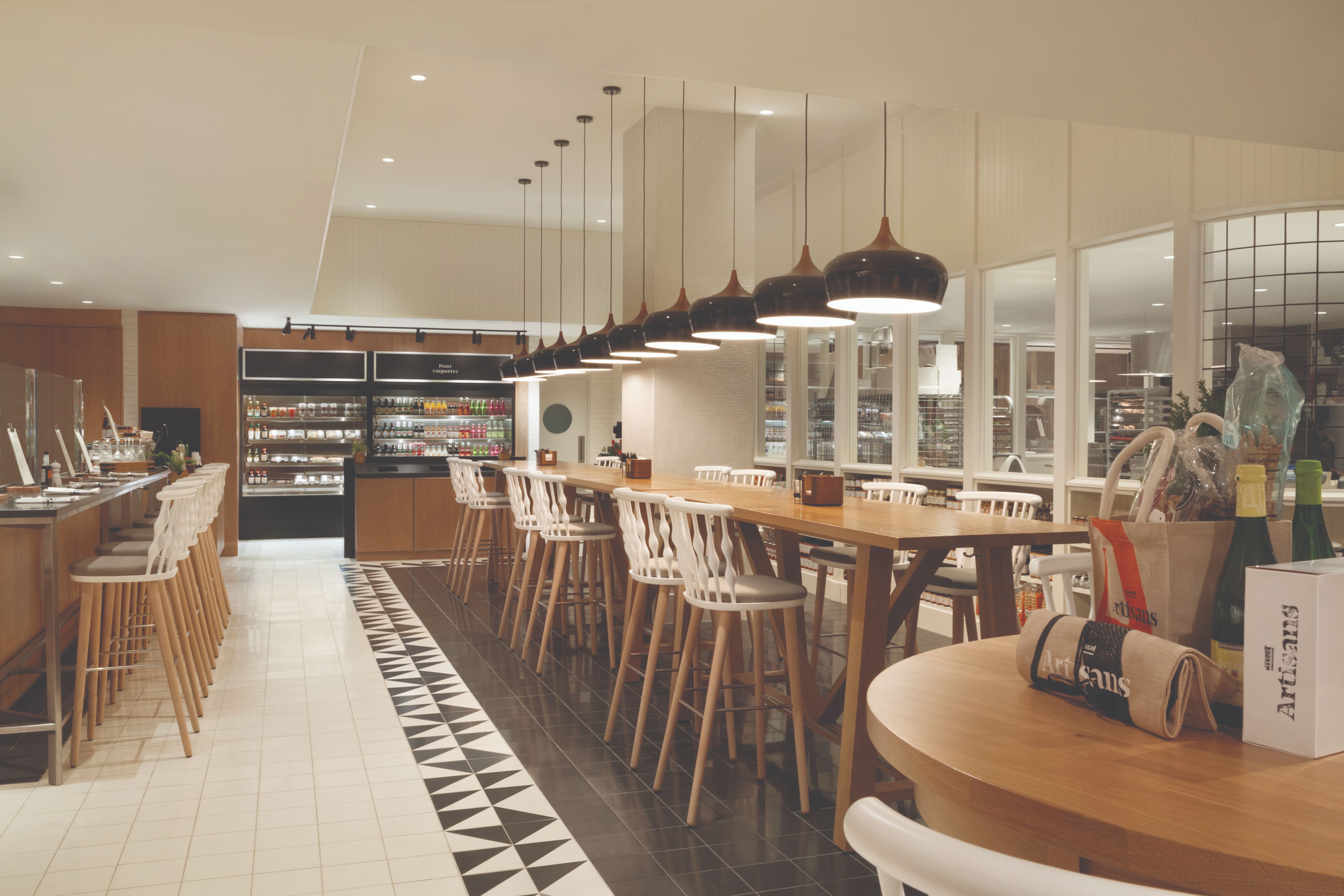 a long table with chairs and a table with stools
