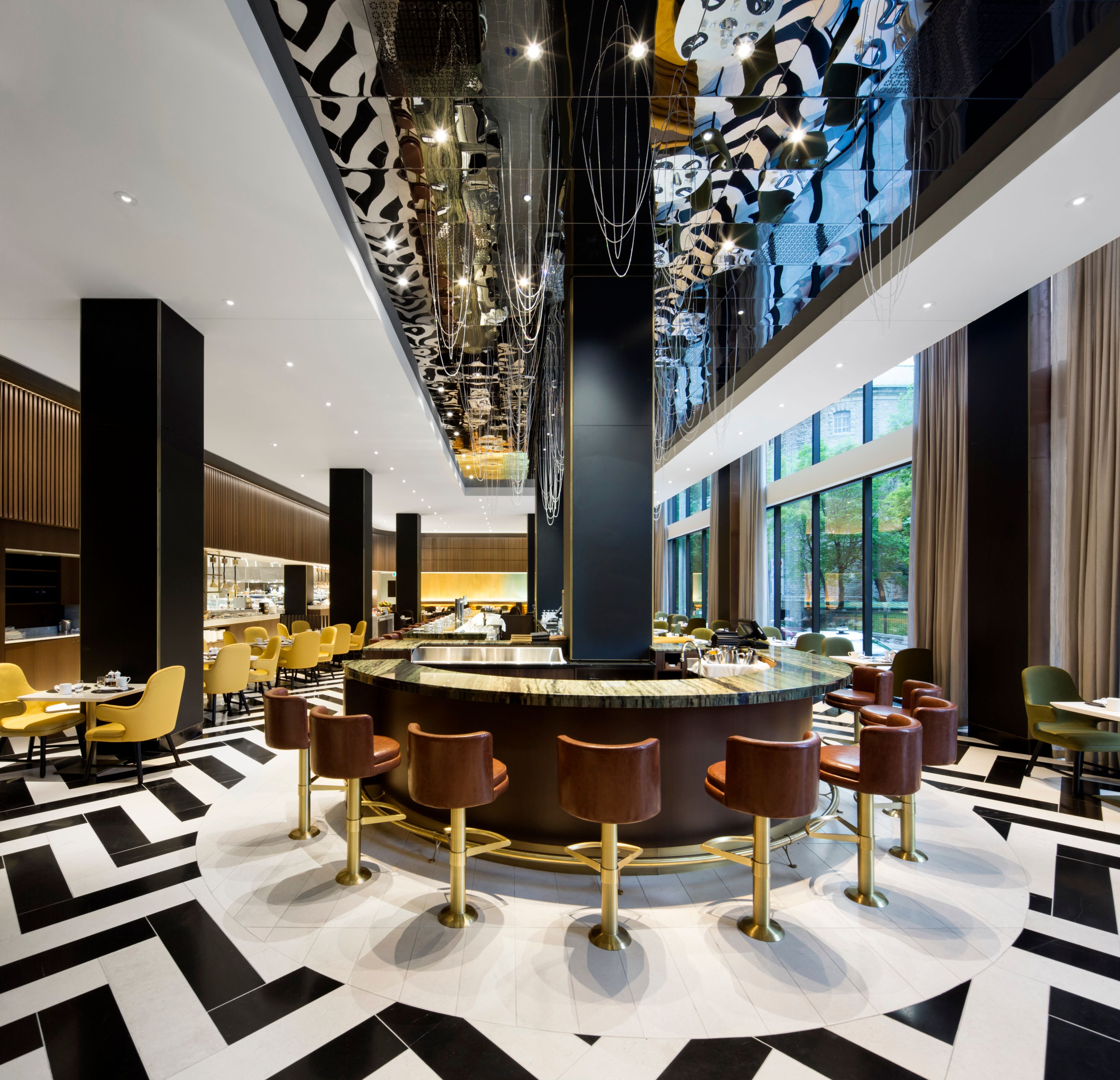 a room with a bar and chairs