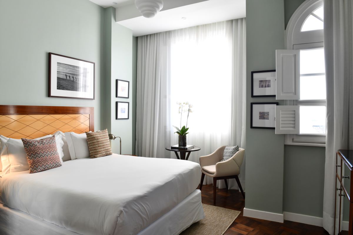 a bedroom with a bed and chair