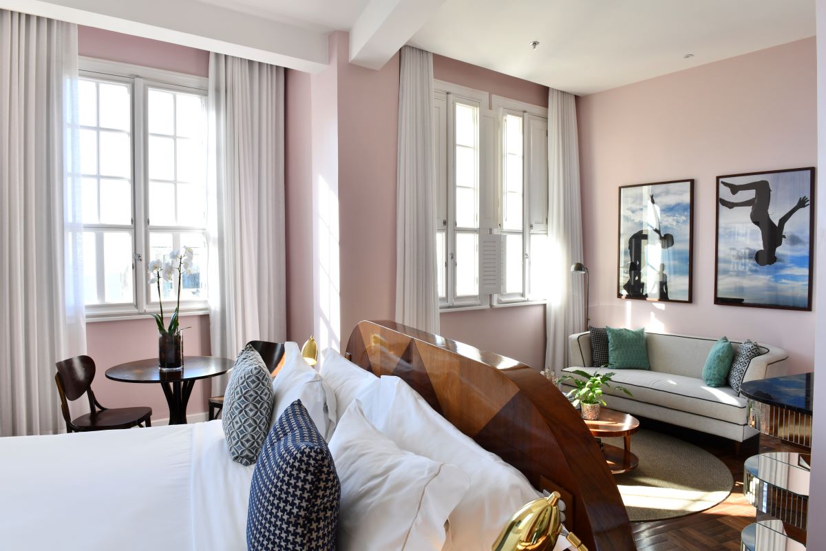 a bedroom with a bed and a couch