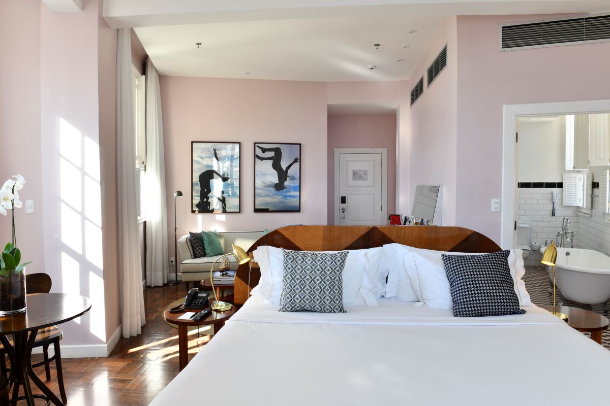 a bed with pillows in a room