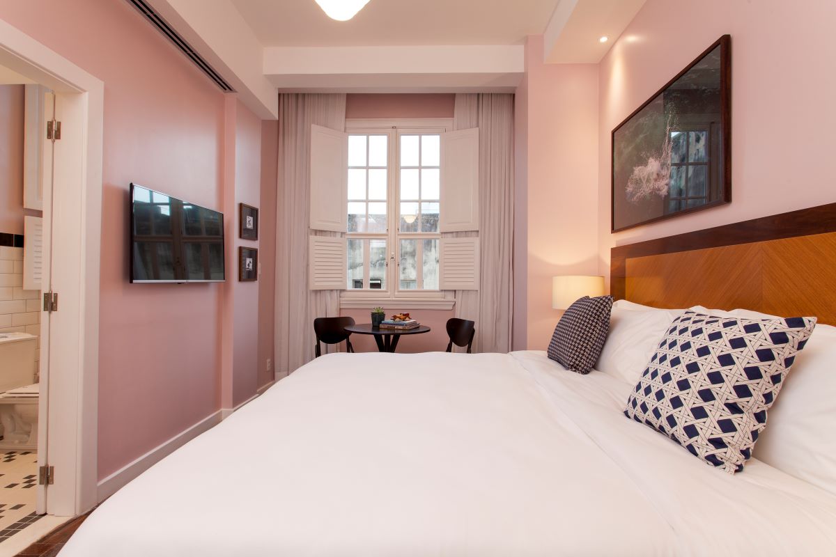 a bedroom with a bed and a table