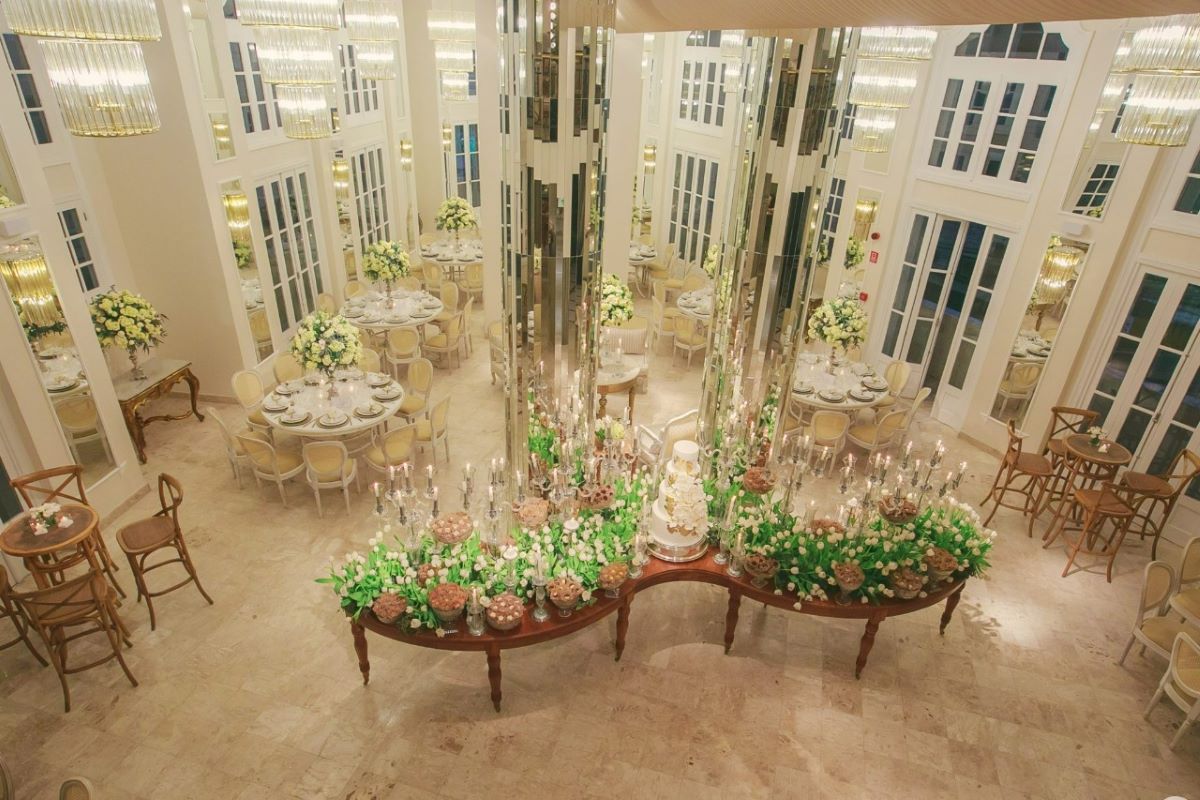 a room with tables and chairs and a cake