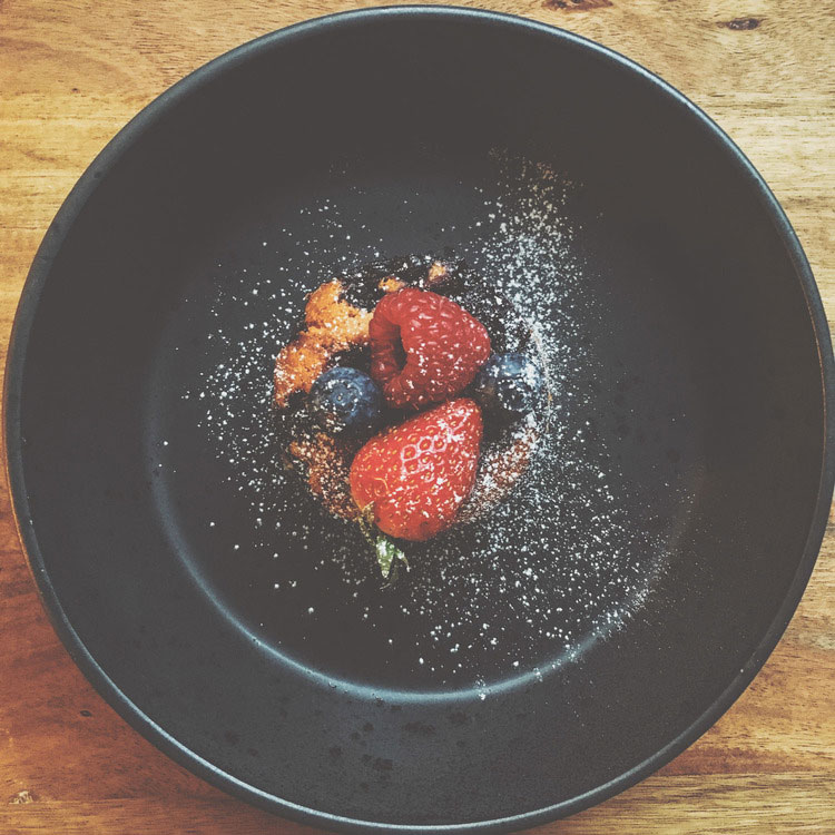 a bowl of fruit on a table