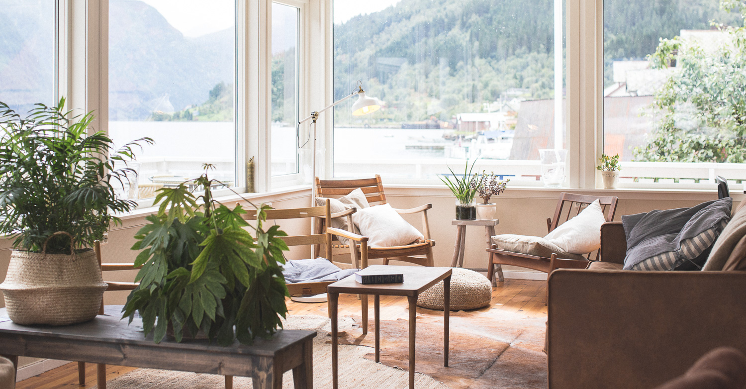 a room with a large window and a large view of the mountains