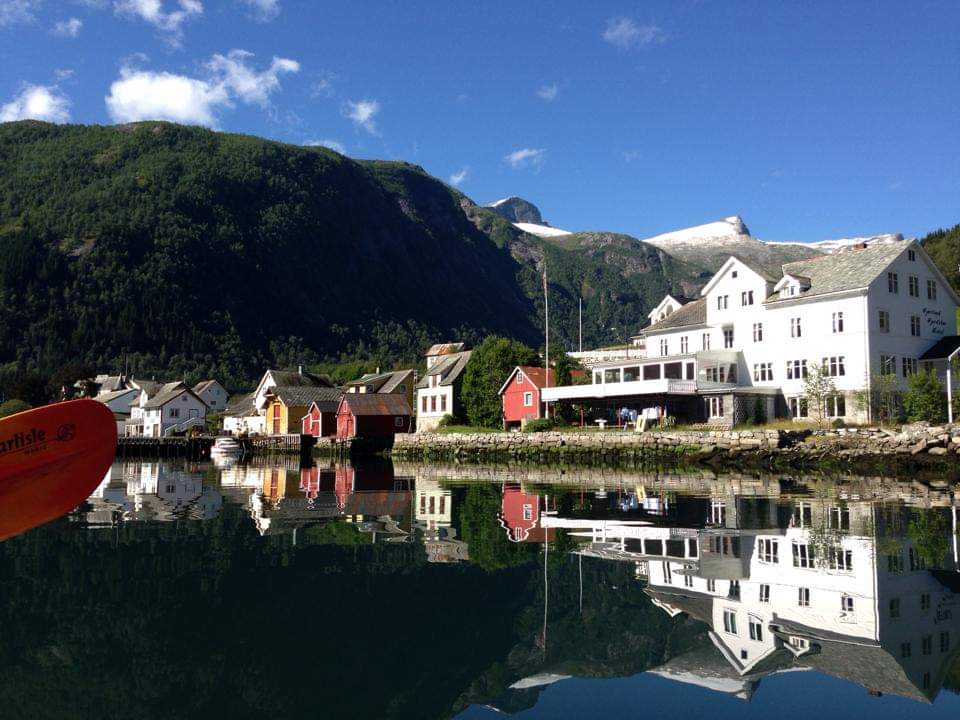 a group of houses next to a body of water