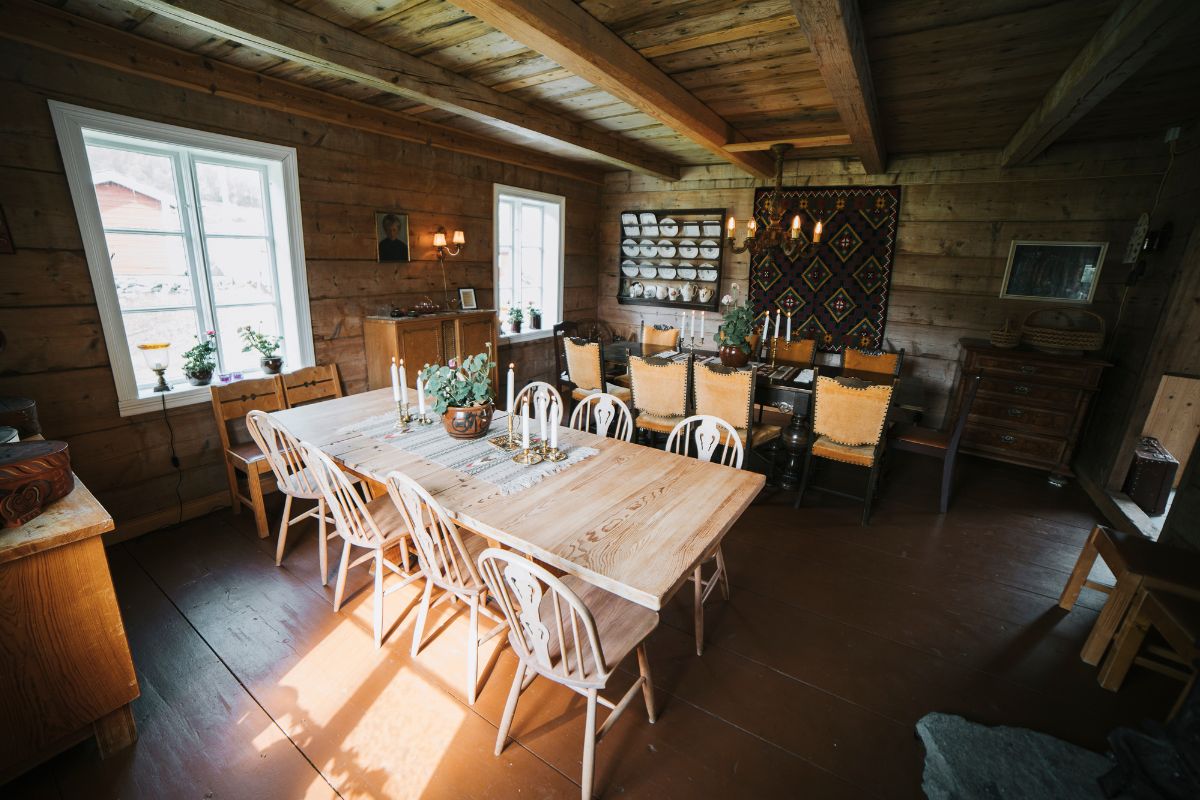 a dining room with a table and chairs