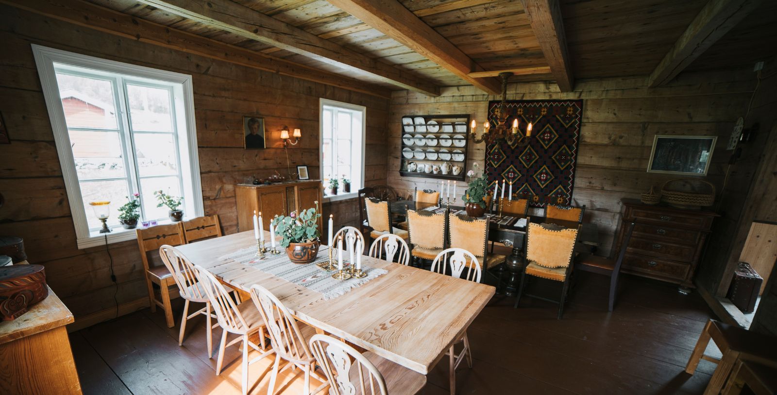 a dining room with a table and chairs