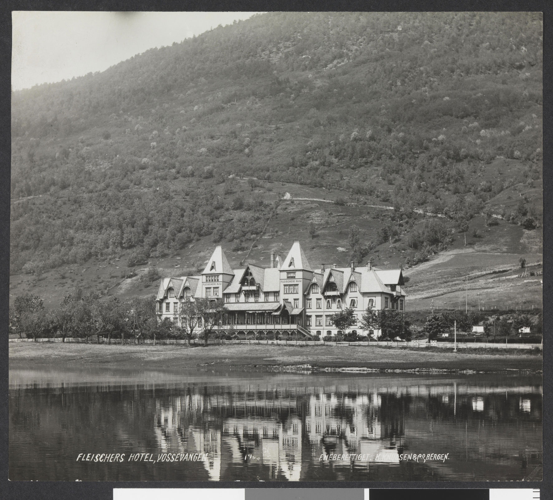 a building next to a body of water