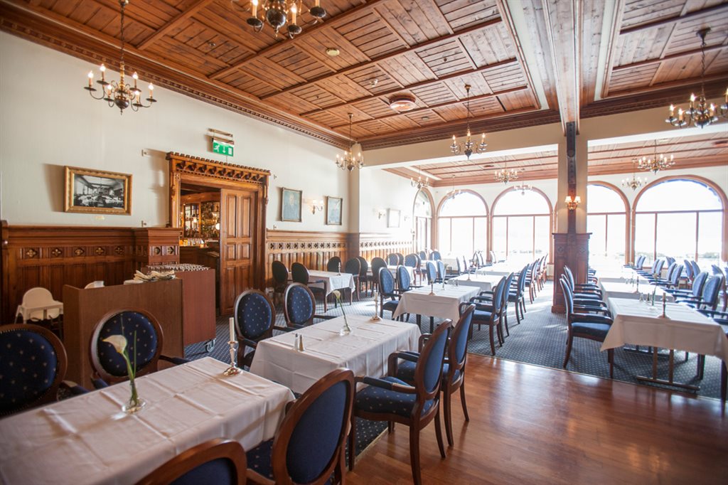 a room with tables and chairs