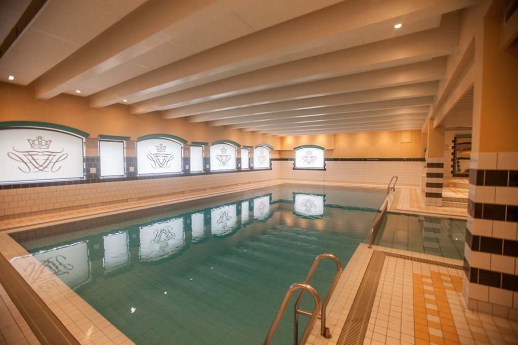 a indoor pool with a ladder