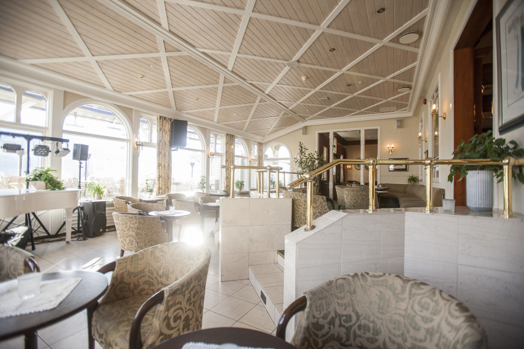 a room with chairs and tables