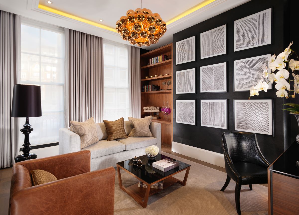 a living room with a chandelier and a couch
