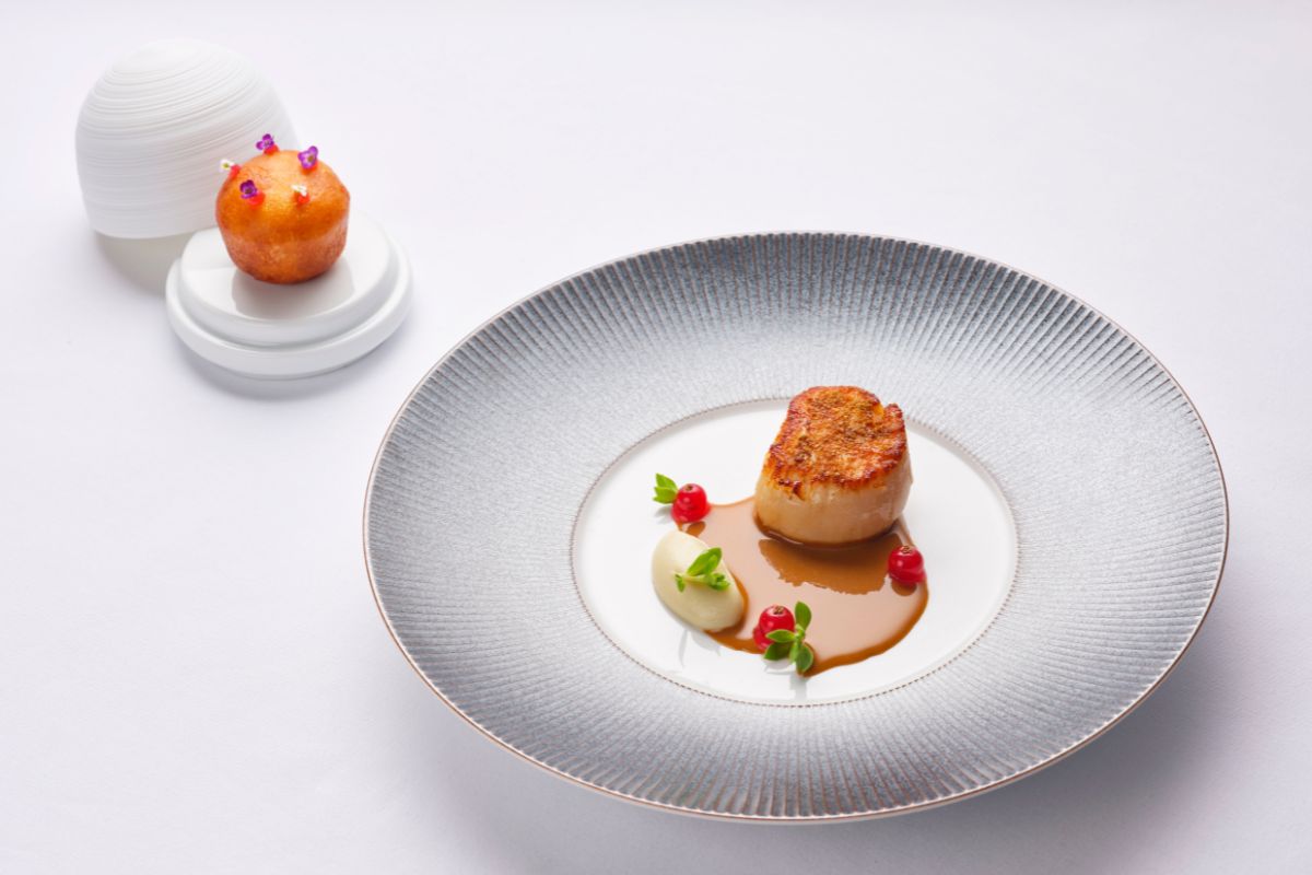 a plate of food on a white surface