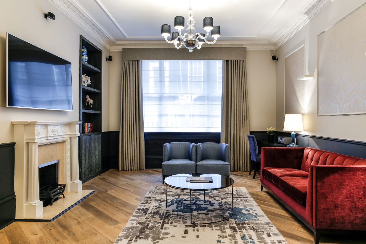 a living room with a fireplace and couches
