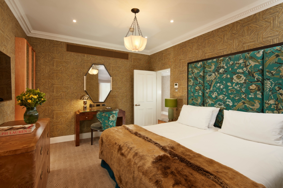 a room with a bed and a desk