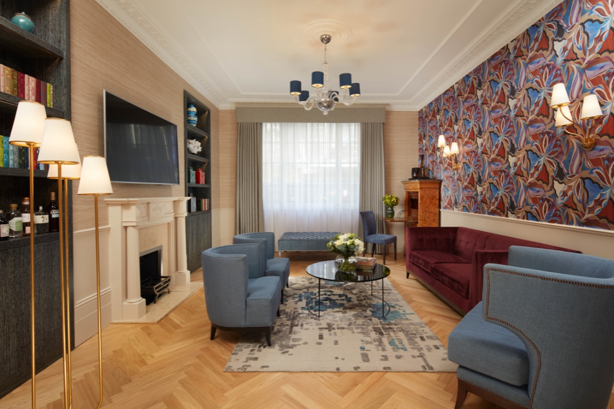 a room with a fireplace and couches