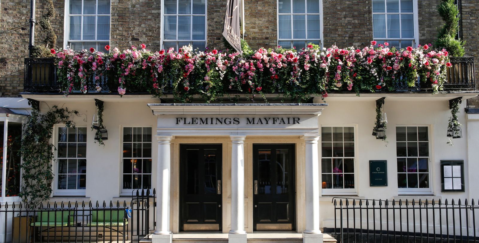 a building with flowers on the front