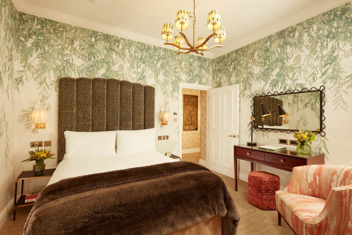 a bedroom with a bed and a desk