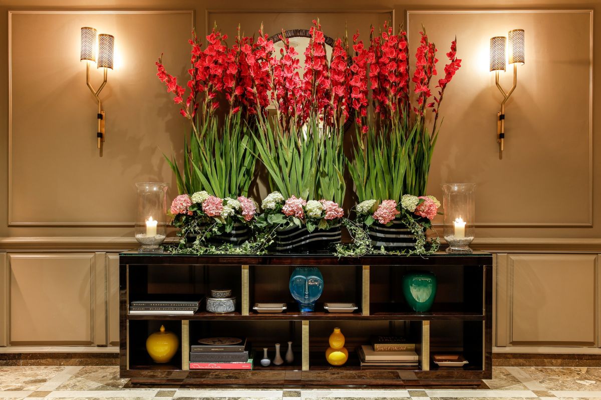 a table with flowers and candles