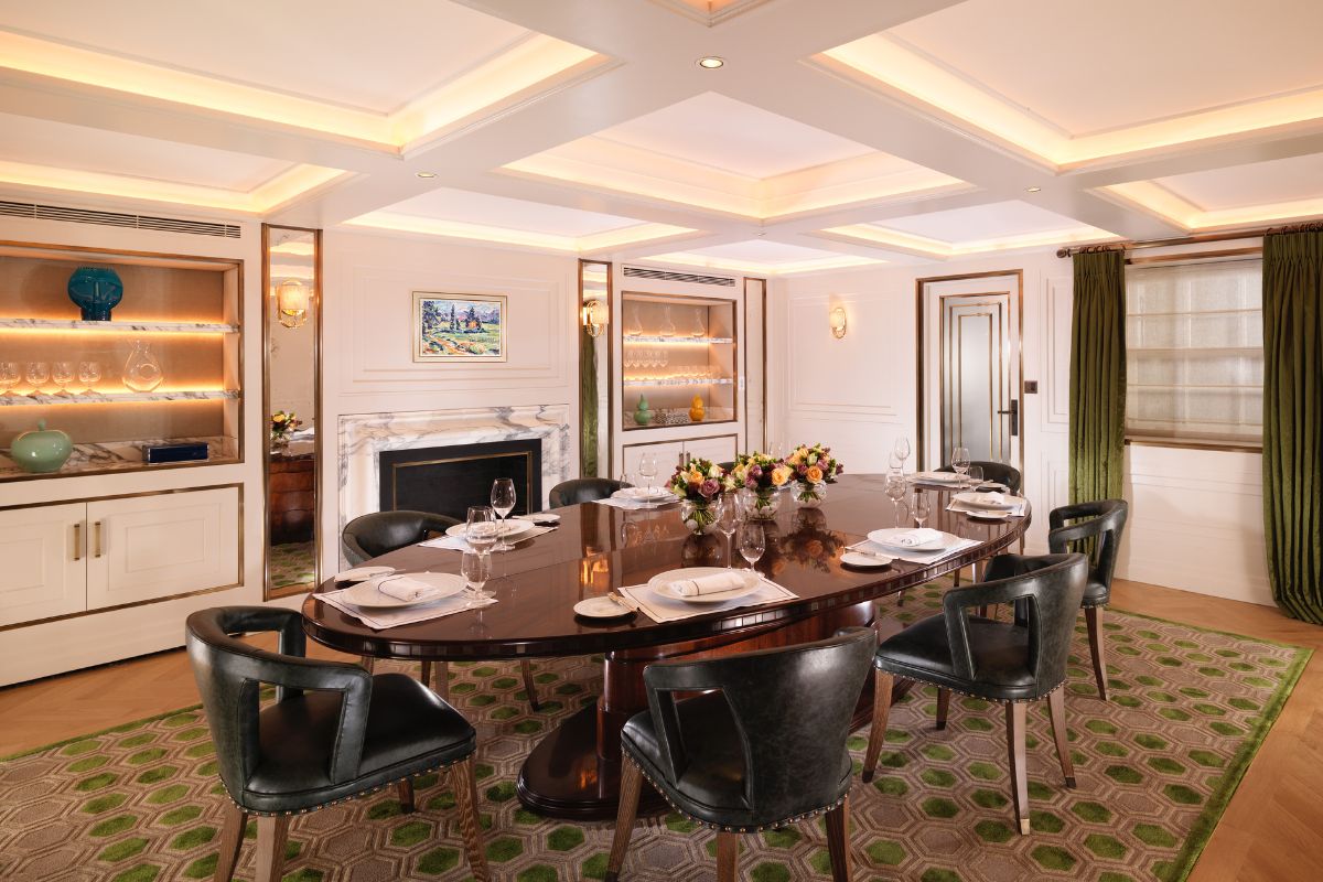 a room with a large table and chairs