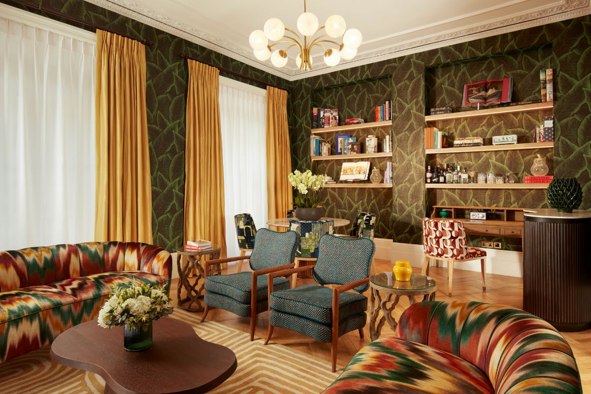a living room with a couch and chairs