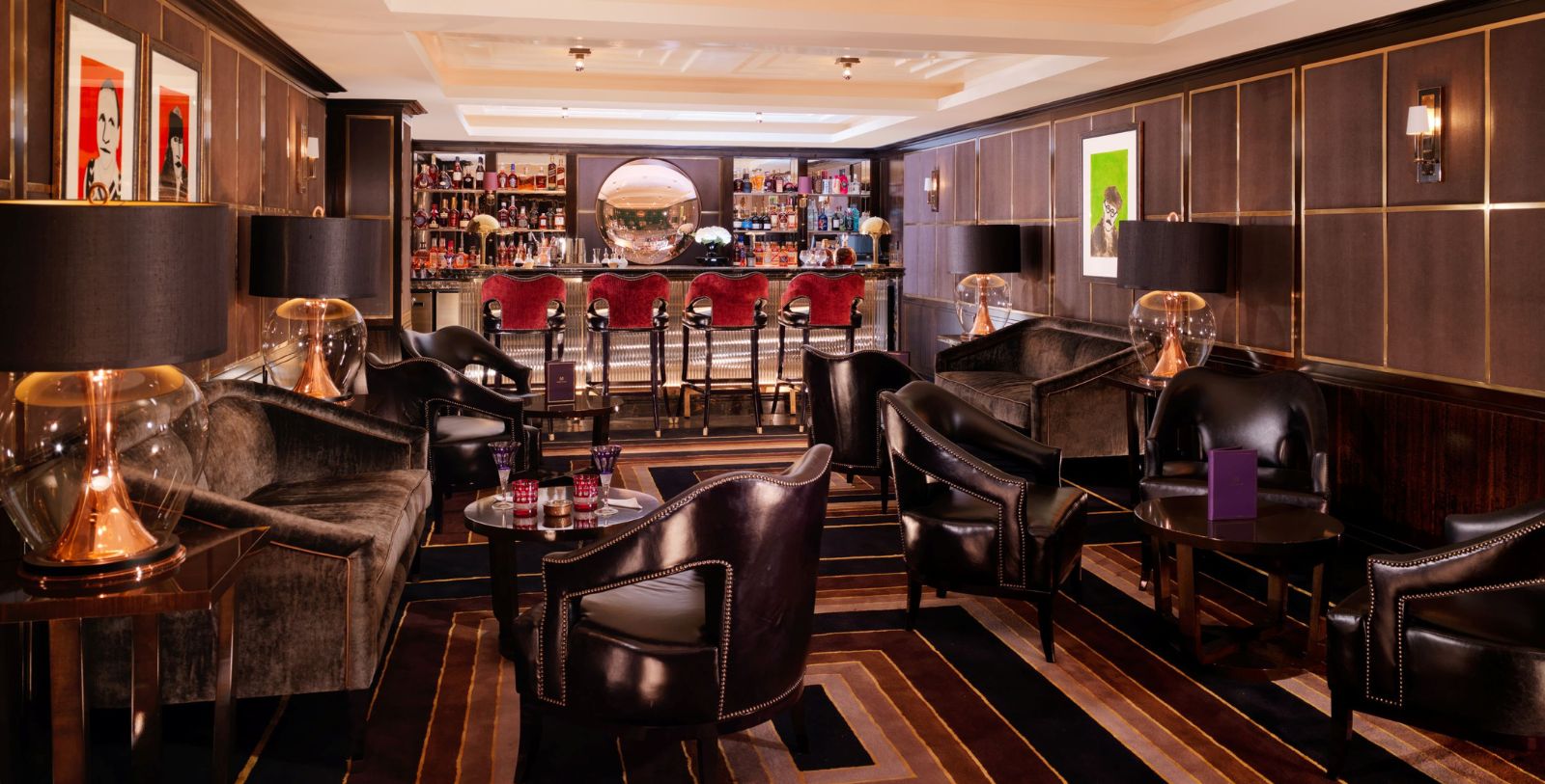 a room with a bar and chairs
